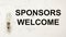 Welcome sponsors, text. Light bulb attribute