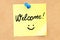 Welcome text on a sticky note pinned to a corkboard. 3D rendering