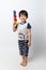 Welcome Thailand Songkran festival, Portrait of Asian boy smiled with water gun on white background