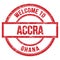 WELCOME TO ACCRA - GHANA, words written on red stamp