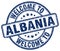 welcome to Albania blue round stamp