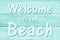 Welcome to the beach message on weathered whitewash wood