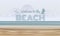 Welcome to the beach text on Sand and sea abstract background vector design