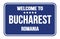 WELCOME TO BUCHAREST - ROMANIA, words written on blue street sign stamp