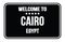 WELCOME TO CAIRO - EGYPT, words written on black street sign stamp
