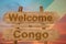 Welcome to Congo sing on wood background with blending national flag