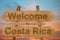 Welcome to Costa Rica sing on wood background