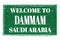 WELCOME TO DAMMAM - SAUDI ARABIA, words written on green stamp