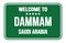 WELCOME TO DAMMAM - SAUDI ARABIA, words written on green street sign stamp