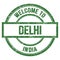 WELCOME TO DELHI - INDIA, words written on green stamp