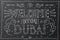 Welcome to Dubai. Hand drawn vintage lettering on black chalkboard.