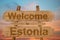 Welcome to Estonia sing on wood background