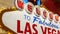 Welcome to fabulous Las Vegas retro neon sign in gambling tourist resort, USA. Iconic vintage glowing banner, symbol of casino,