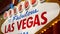 Welcome to fabulous Las Vegas retro neon sign in gambling tourist resort, USA. Iconic vintage glowing banner, symbol of casino,
