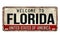 Welcome to Florida vintage rusty metal plate