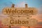 Welcome to Gabon sing on wood background