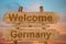 Welcome to Germany sing on wood background
