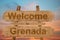 Welcome to Grenada sing on wood background