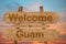 Welcome to Guam sing on wood background