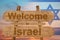 Welcome to Israel sing on wood background with blending national flag