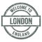 WELCOME TO LONDON - ENGLAND, words written on gray stamp