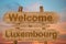 Welcome to Luxembourg sign on wood background