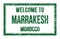 WELCOME TO MARRAKESH - MOROCCO, words written on green rectangle stamp