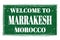 WELCOME TO MARRAKESH - MOROCCO, words written on green stamp