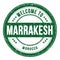 WELCOME TO MARRAKESH - MOROCCO, words written on green stamp