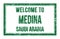 WELCOME TO MEDINA - SAUDI ARABIA, words written on green rectangle stamp