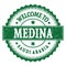 WELCOME TO MEDINA - SAUDI ARABIA, words written on green stamp