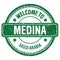 WELCOME TO MEDINA - SAUDI ARABIA, words written on green stamp