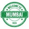 WELCOME TO MUMBAI - INDIA, words written on green stamp