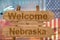 Welcome to Nebraska state in USA sign on wood, travell theme