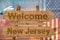 Welcome to New Jersey state in USA sign on wood, travell theme