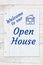 Welcome to our Open House message on lined crumpled paper on weathered wood