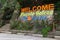 `Welcome to Puerto Galera, the heart of Asia` sign in stone, Mindoro island, Tamaraw waterfalls, popular tourist place of Philippi