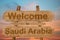 Welcome to Saudi Arabia sign on wood background