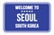WELCOME TO SEOUL - SOUTH KOREA, words written on blue street sign stamp
