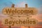 Welcome to Seychelles sign on wood background