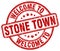 Welcome to Stone Town red round stamp