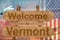 Welcome to Vermont state in USA sign on wood, travell theme