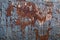 Welded sections of steel, heavy rust and peeling paint background, copy space