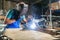 Welder brewing a metal welding machine
