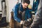 Welder checking angle of welded materials