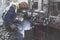 Welder doing welding on deck of ship lashing cargo