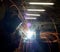 Welder at the industrial factory welding or steel fabrication work