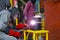 Welder man are welding reduce pipe