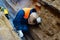 Welder repairs the pipeline in the mine