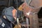 Welder in the shop weld of the sample insert tube into the pipe